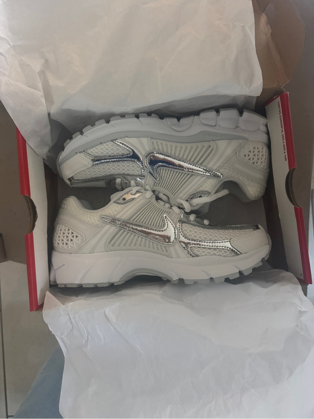 Nike Vomero Womens White and Chrome Metallic Sneakers